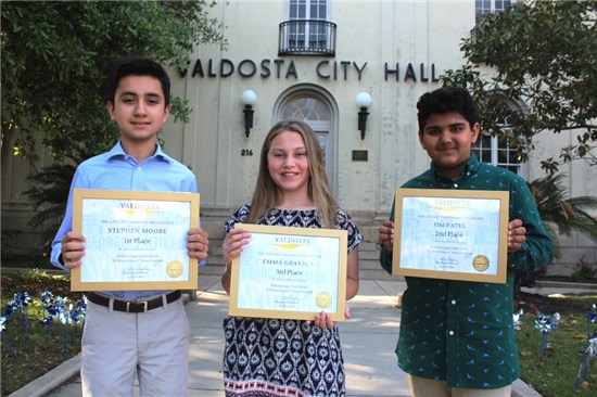 In photo from left to right: Stephen Moore, Emma Graybeal, and Om Patel